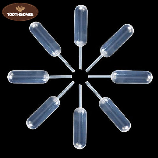 clear plastic disposable transfer pipette dropper isolated on black background