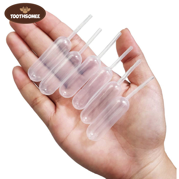 clear plastic disposable transfer pipette dropper isolated on black background