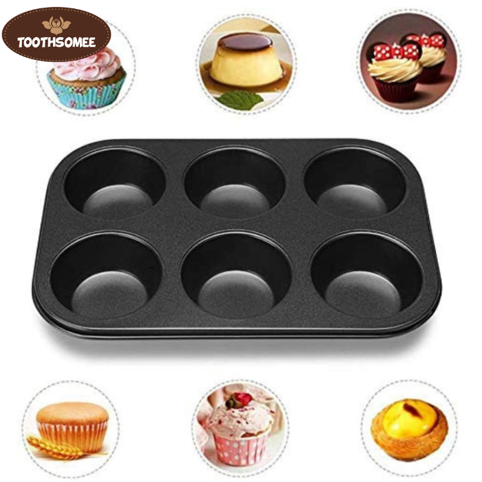 Non-stick 6-cup muffin tray with freshly baked muffins placed on a kitchen counter