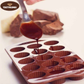 Non-stick silicone molds filled with melted chocolate ready to set