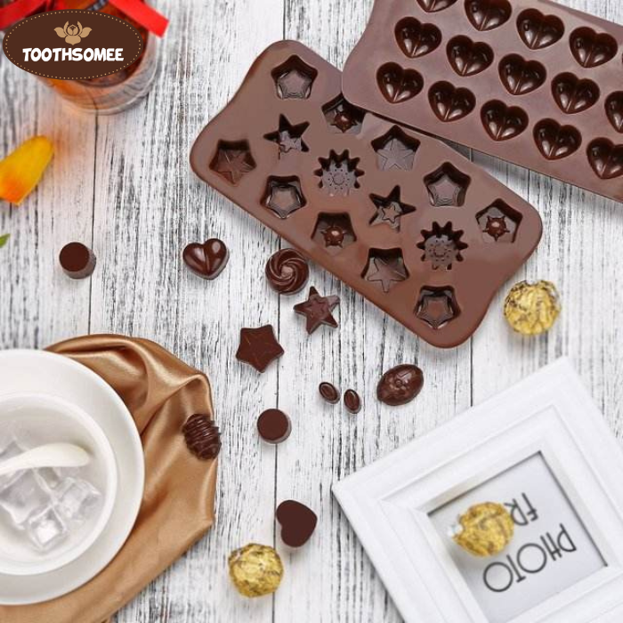 Non-stick silicone molds filled with melted chocolate ready to set