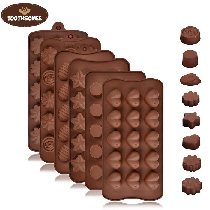 Non-stick silicone molds filled with melted chocolate ready to set