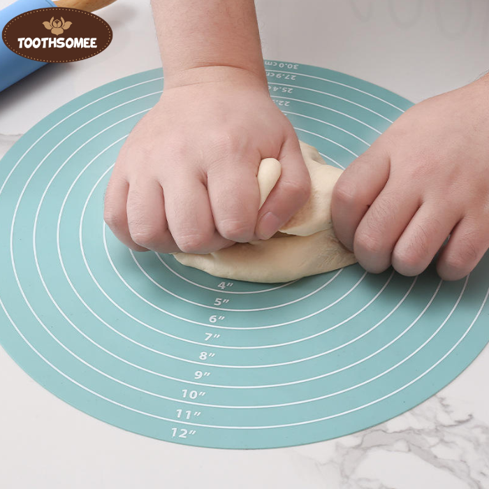 Round silicone baking mat with printed measurements used for rolling dough